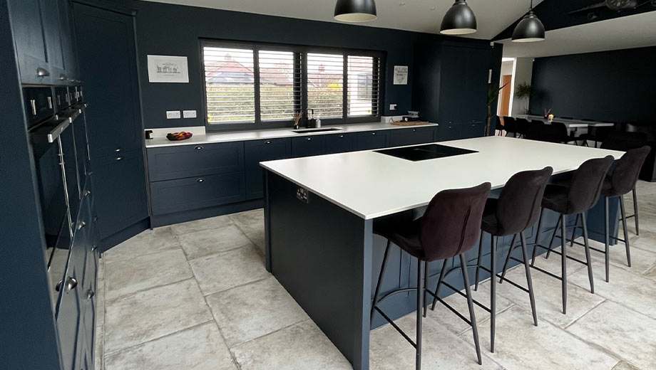 Monochrome blue kitchen featuring blue kitchen island