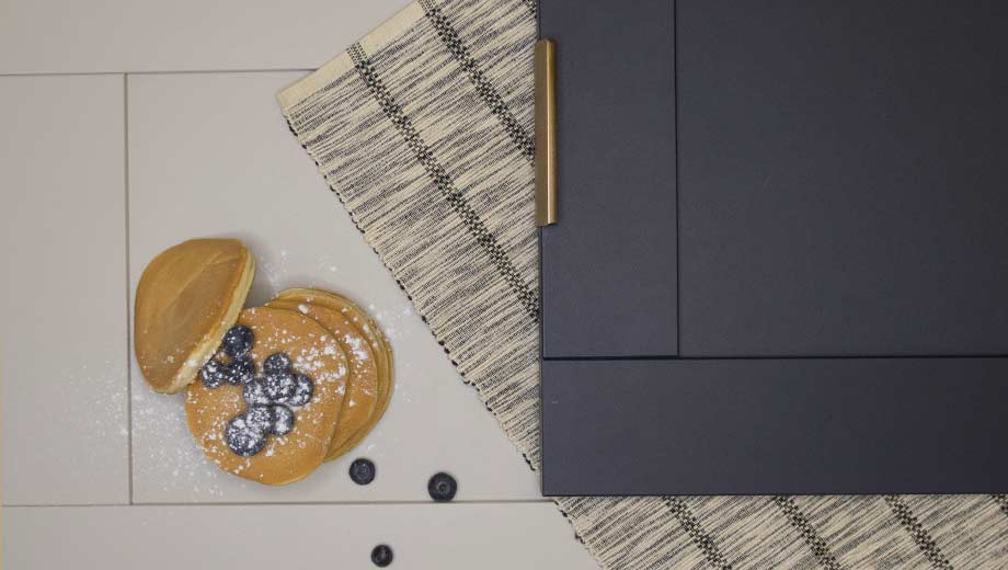 Navy kitchen doors paired with warm grey shaker doors