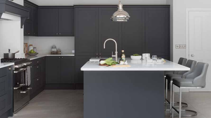 Kitchen island in a dark grey shaker kitchen