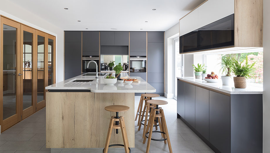 Dark kitchen with modern cabinets and wood design features