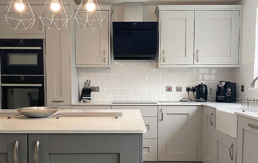 Grey shaker kitchen featuring kitchen island