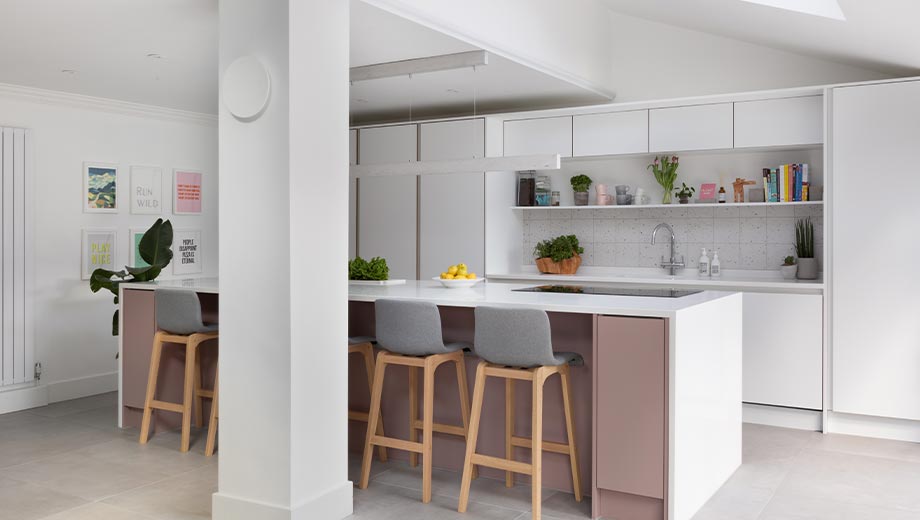 Open plan kitchen living room with pink kitchen island