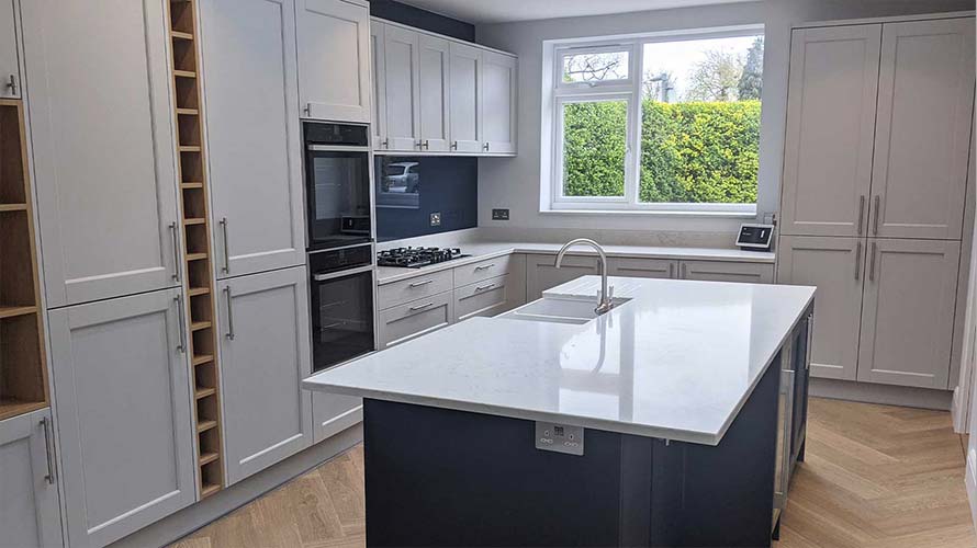 Grey shaker kitchen with blue kitchen island