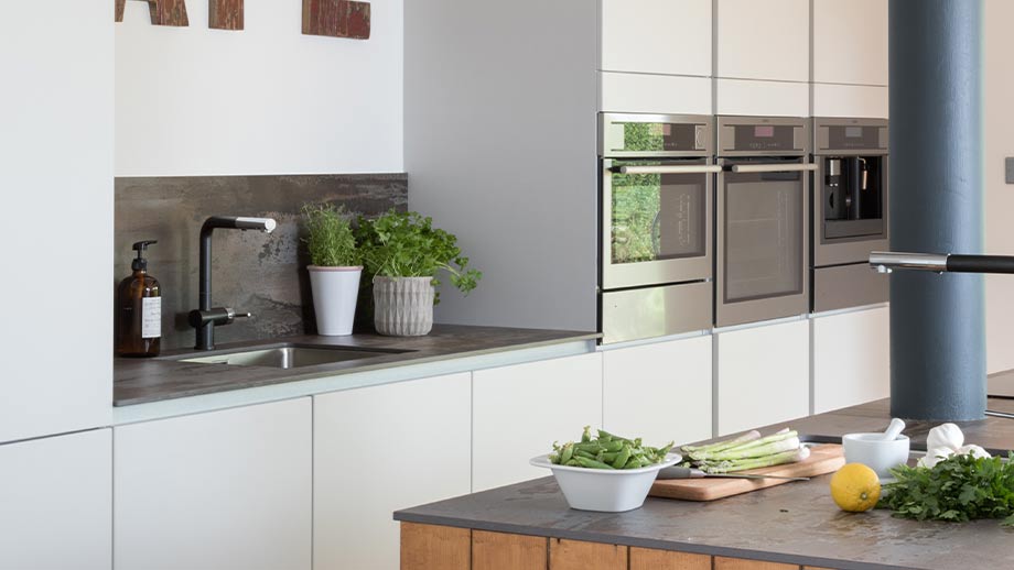 Grey kitchen cabinets in an industrial kitchen