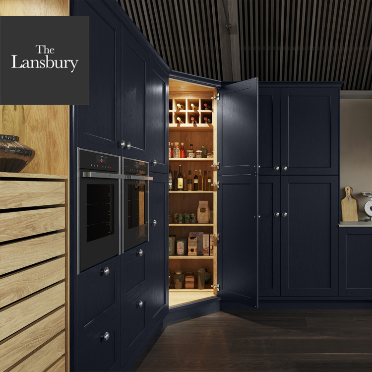 Lansbury kitchen corner pantry with dark blue doors and oak interior