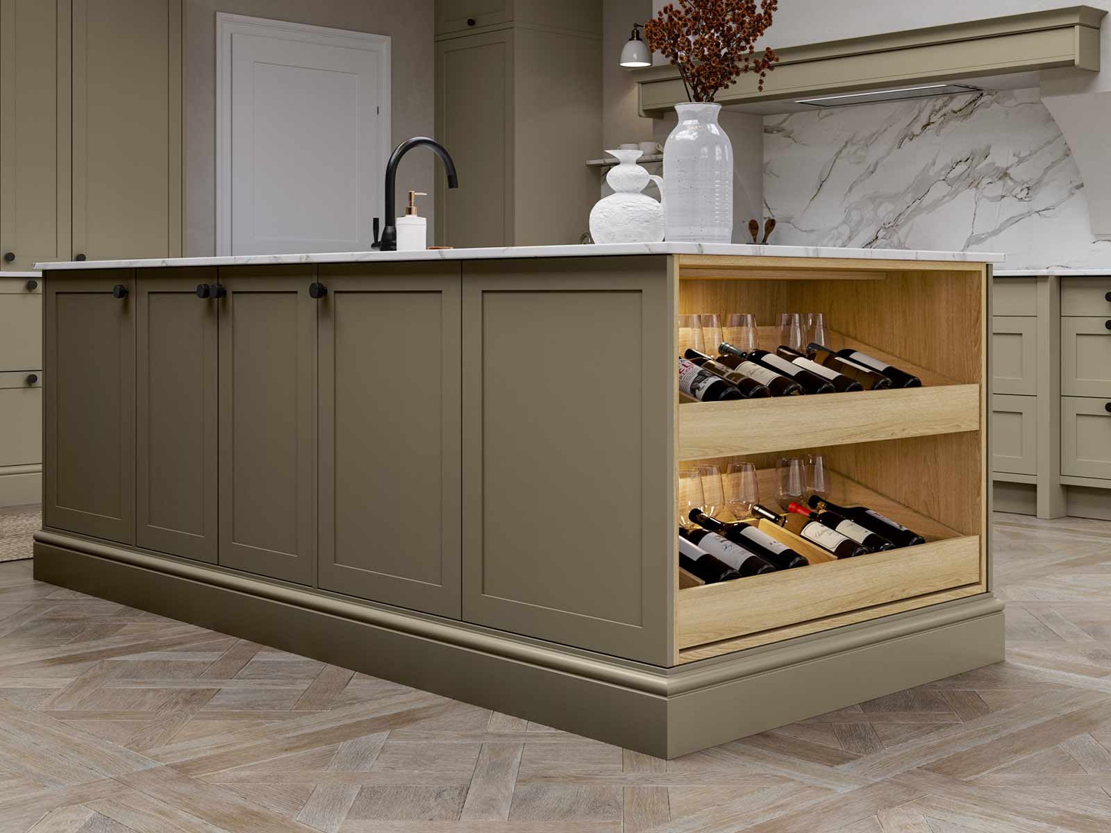 A cottage kitchen island with a wine drawer
