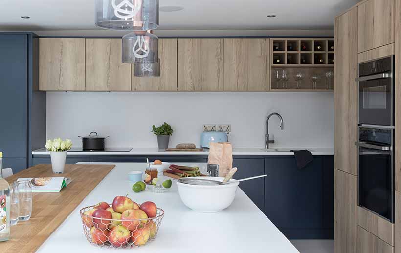 Modern kitchen with blue and oak featuring kitchen island