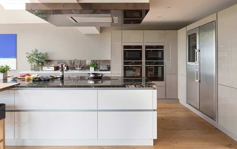 A modern kitchen with tall kitchen units