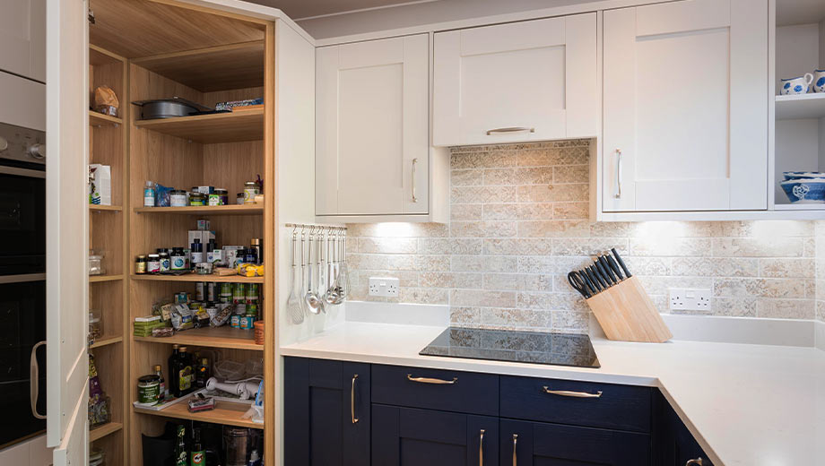 A small kitchen design with corner pantry storage and modern design