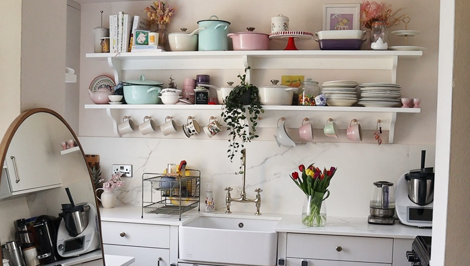 Small kitchen design with open shelving feature and knob handles