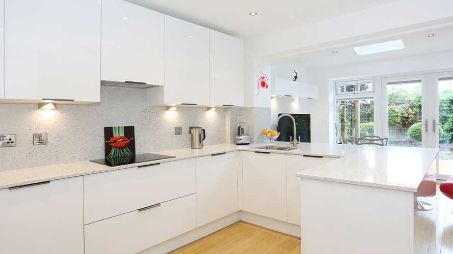 Small kitchen island in a white shaker kitchen