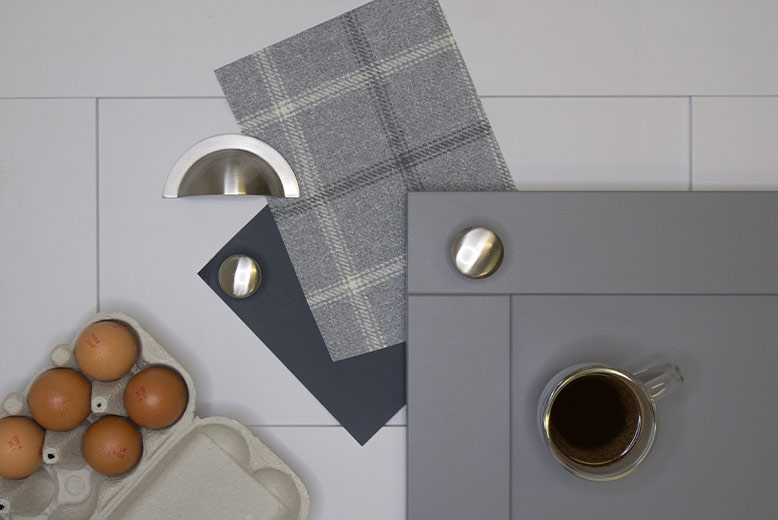 Two tone grey matt kitchen doors with silver cup and knob handles