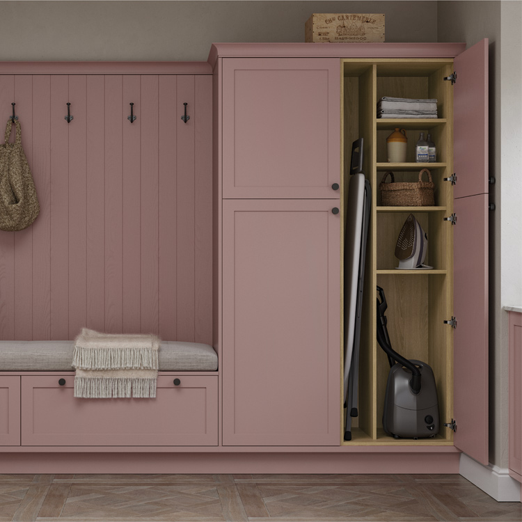 Utility room cupboard containing a divider, attached to a pink boot room